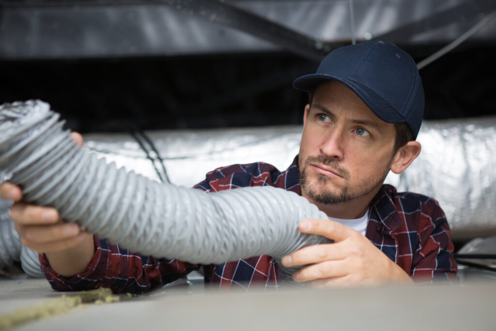 stock-photo-hvac-technician-ready-to-install-ventilation-system-in-house-1346792984