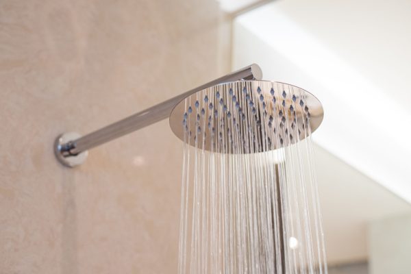 stock-photo-shower-turned-on-overhead-ceiling-shower-faucet-head-closeup-1417551221