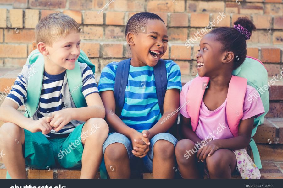 stock-photo-happy-school-kids-sitting-together-on-staircase-at-school-447170968