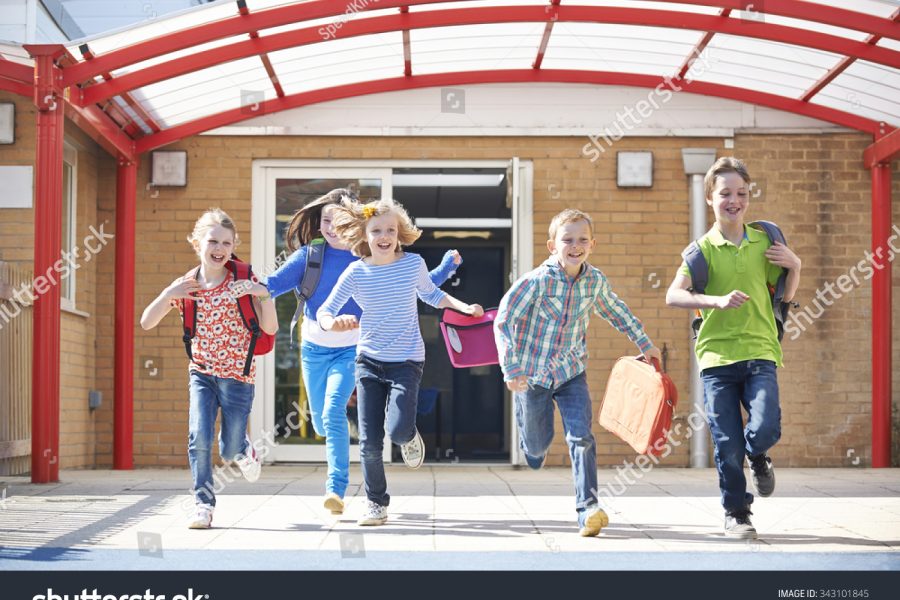 stock-photo-schoolchildren-running-into-playground-at-end-of-class-343101845