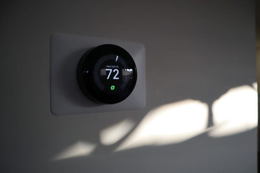 stock-photo-thermostat-in-a-house-at-sundown-2293679881